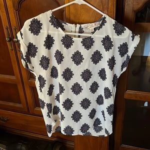 Women’s size medium blouse for $10 never worn but without tags.
